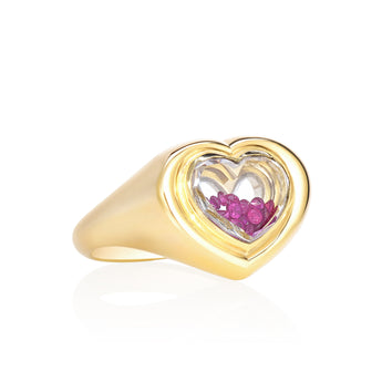 The Afeto Signet Ring Ruby by Moritz Glik with 0.25ct of rubies enclosed in a Kaleidoscope Shaker™ in 18k gold.