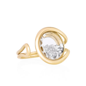 Bote Open Ring by Moritz Glik in 18k yellow gold with 1.0ct diamonds enclosed in a round Kaleidoscope Shaker on white background, facing right